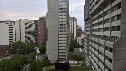 Buildings in city against sky