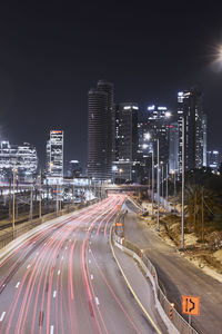 Illuminated city street at night, long exposure