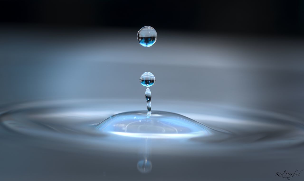 CLOSE-UP OF WATER DROP IN MID-AIR