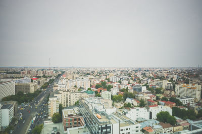 High angle view of street and buildings against sky