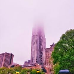 Low angle view of skyscrapers against clear sky