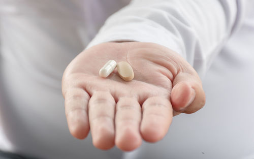 Close-up of man holding hands