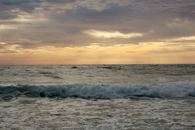 Beautiful sunset on the beach. the surf pounds the shore. phuket, thailand