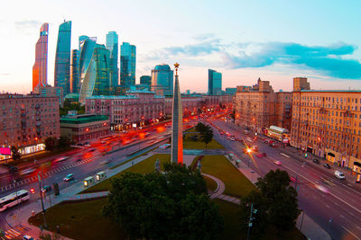 High angle view of city street and buildings against sky