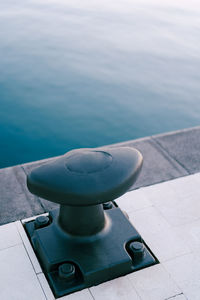 High angle view of railing by sea against sky