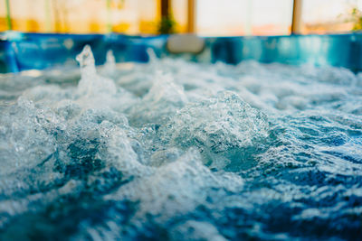 Close-up of water splashing in swimming pool