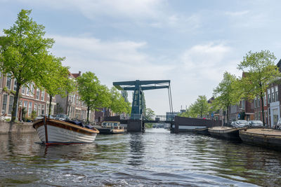 Bridge over canal against sky