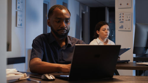 Man using laptop at office