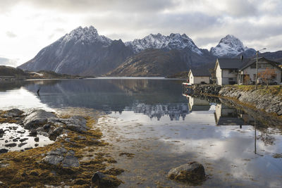 Typical scandinavian house by the lake in autumn