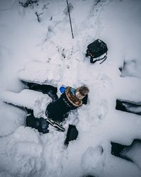 High angle view of people on snow covered field