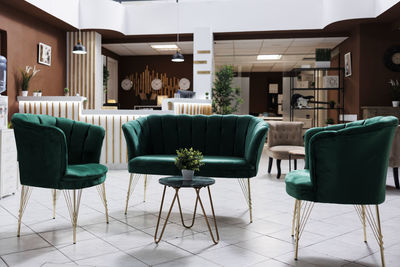 Empty chairs and tables in restaurant