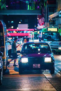 Vehicles on road at night