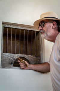 Portrait of man wearing hat