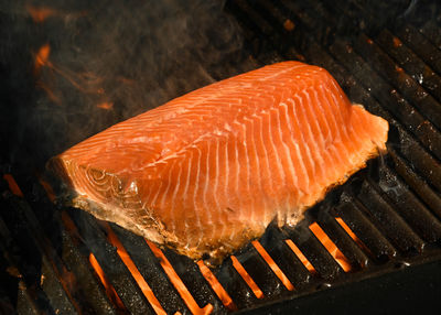 High angle view of fish on barbecue grill