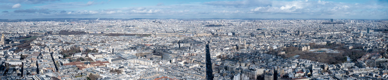 High angle view of crowd in city against sky