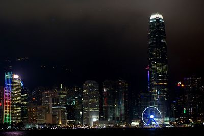 Illuminated buildings in city at night