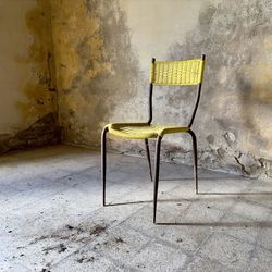 High angle view of empty chairs against wall