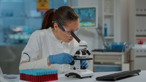 Female dentist working in laboratory