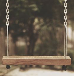 Close-up of empty swing at playground