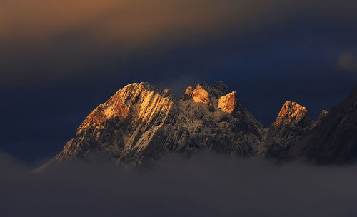 View of trees on mountain against sky