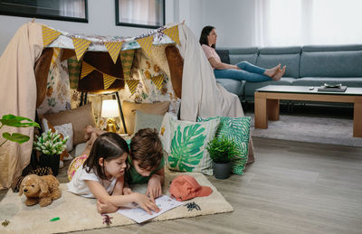 Women sitting on floor at home