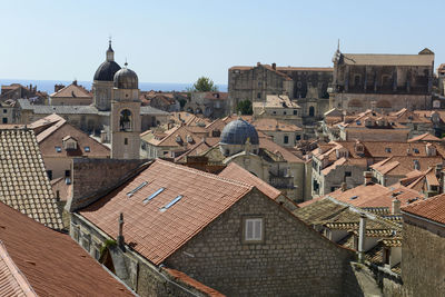 High angle view of buildings in city against clear sky