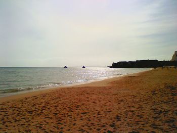 Scenic view of beach against sky