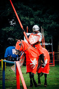 Knight performing jousting while riding on horse