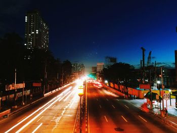 Light trails on city street at night