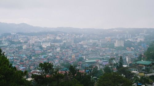 High angle view of buildings in city against sky