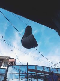 Low angle view of cables against sky