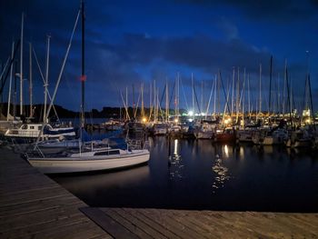 Boats moored at harbor