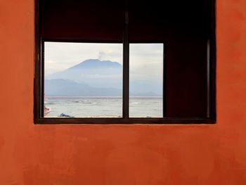 Mountain view  and sea seen through window