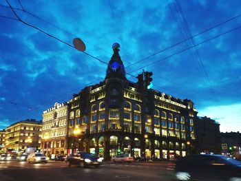 Low angle view of building against cloudy sky