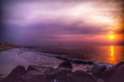 Scenic view of sea against cloudy sky