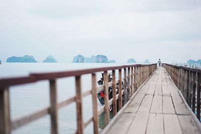 Pier on sea against sky