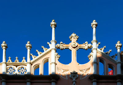 Low angle view of church against clear blue sky