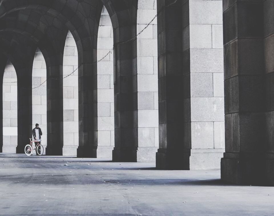 architecture, built structure, lifestyles, arch, architectural column, building exterior, leisure activity, men, indoors, person, history, full length, travel, famous place, day, column, walking