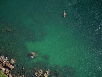 High angle view of rock formation in sea