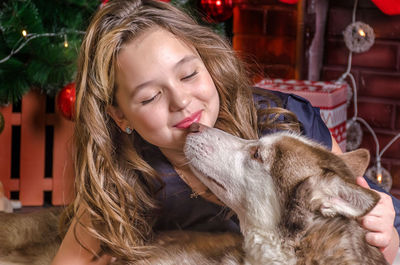 Close-up of smiling woman with dog