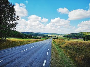 Empty road along landscape