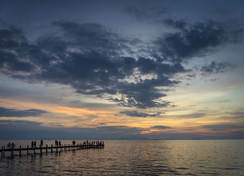 Scenic view of sea against sky at sunset