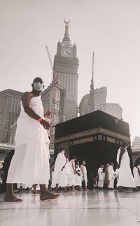 Low angle view of woman standing in temple