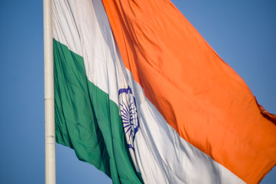 India flag flying high at connaught place with pride in blue sky, india flag fluttering, indian flag