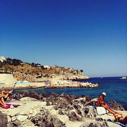 Scenic view of sea against clear blue sky