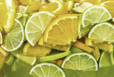 Full frame shot of lemon and orange slices