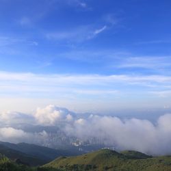 Scenic view of mountains against cloudy sky