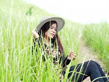 Woman wearing hat on field