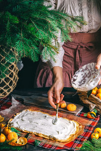 Cropped hand of person preparing food