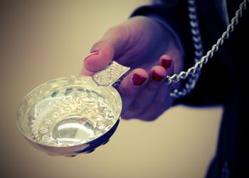 Close-up of hand holding glass